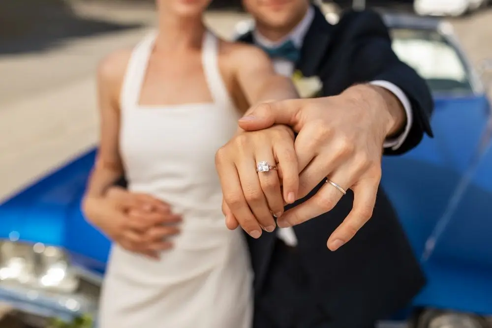 couple just married showing rings