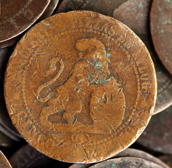 Close-up of an old copper coin