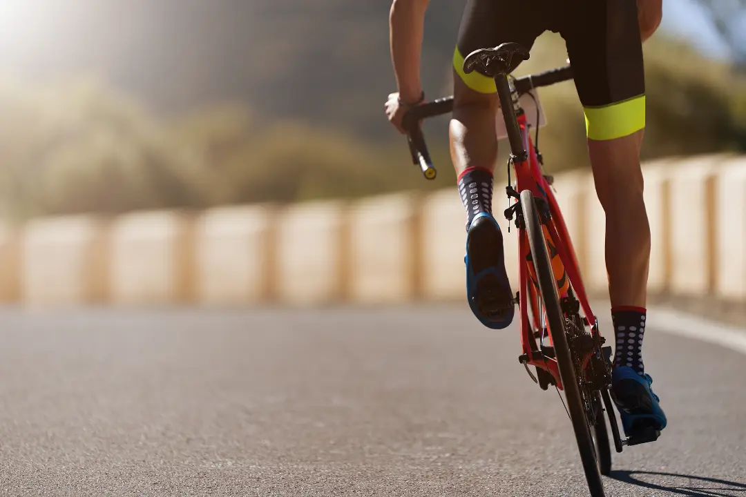bottom half view of person on bicycle 