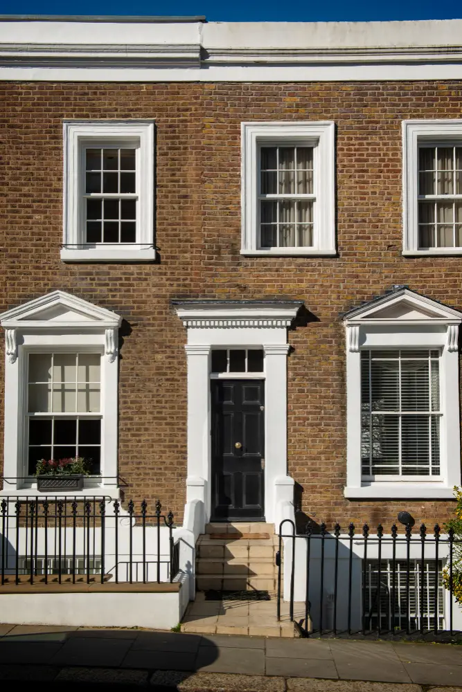 Brick Georgian townhouse with a black front door