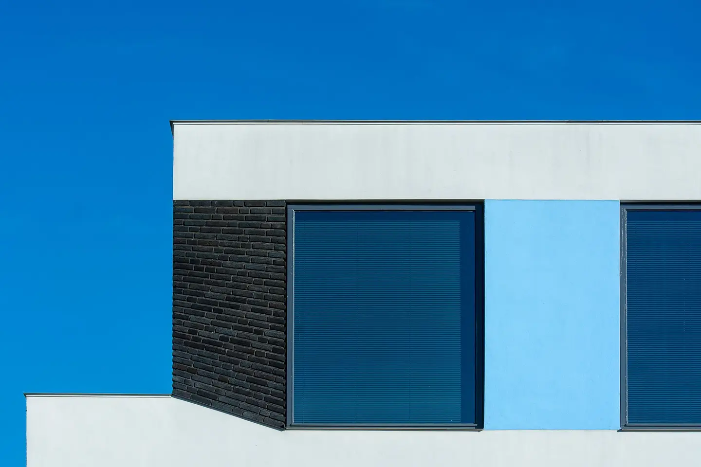 Flat-roofed building against a blue sky