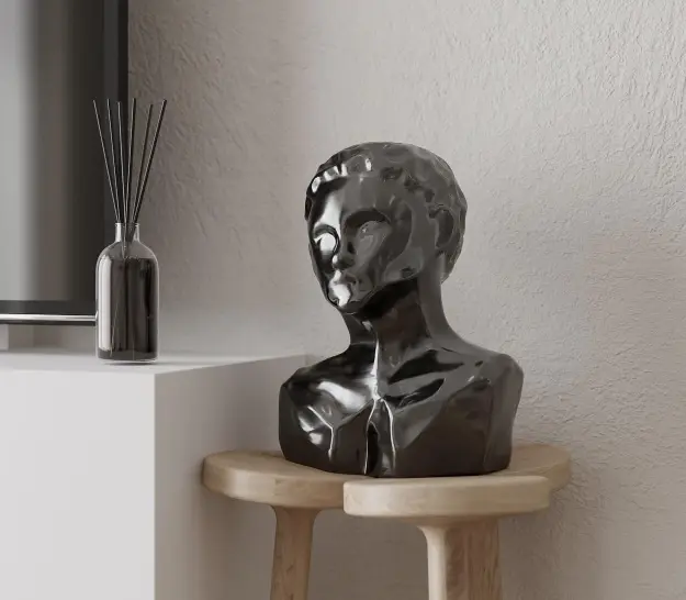Black sculpted bust on a wooden stand