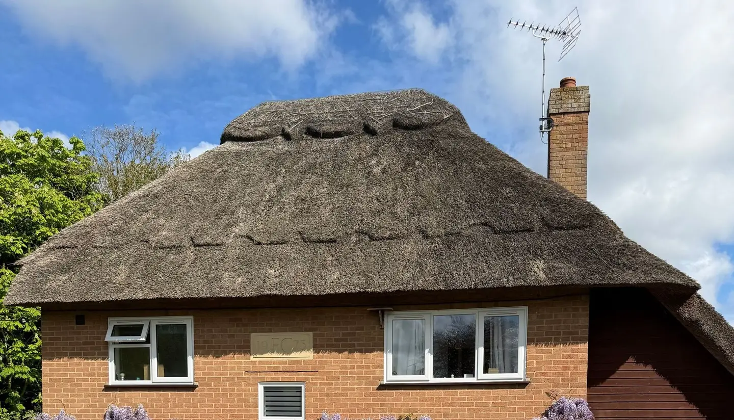 Thatched house in the UK on a sunny day