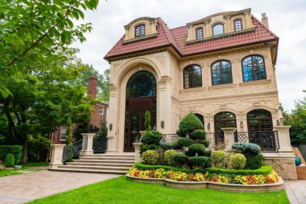 Ornate stone house with a landscaped front garden