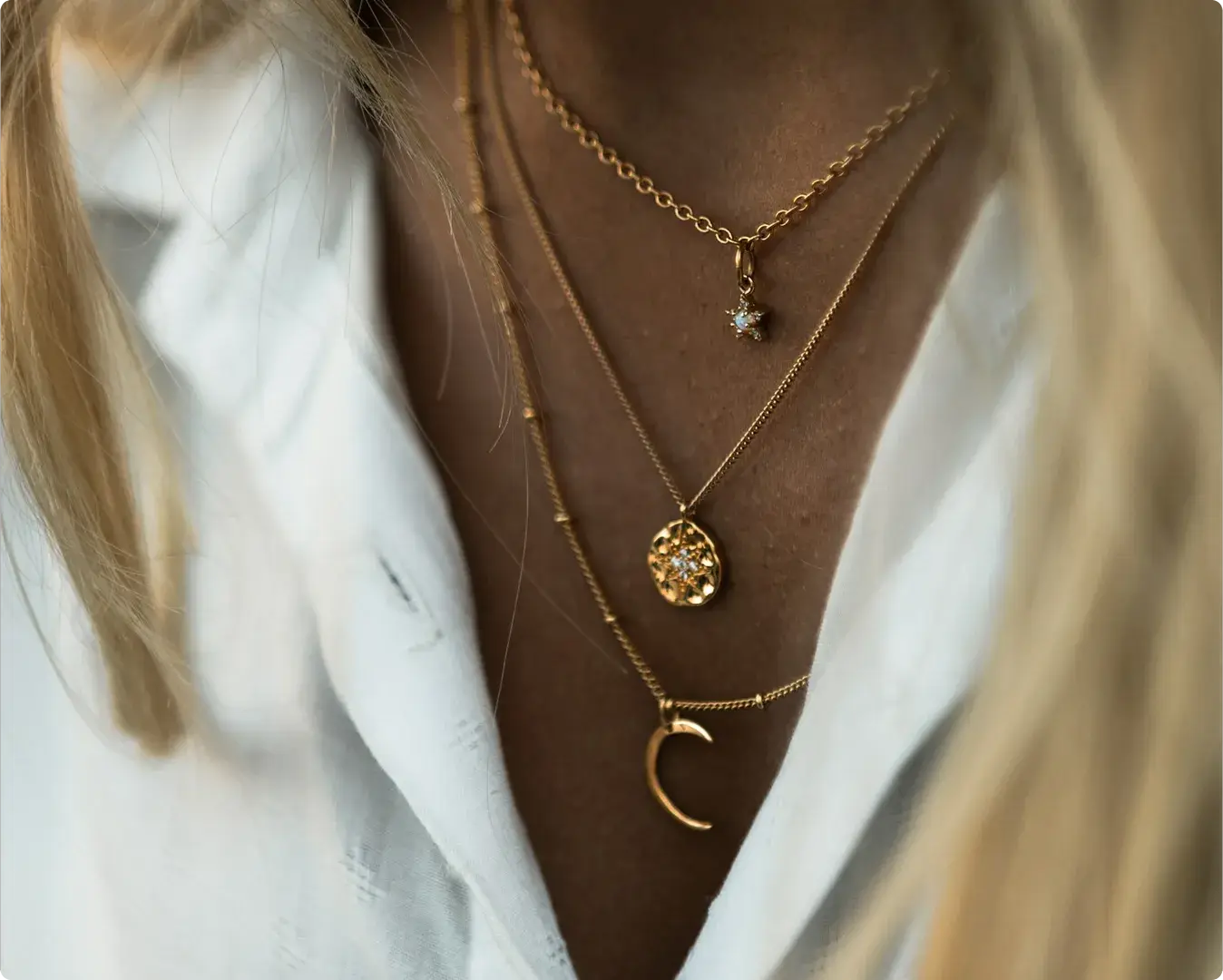Layered gold necklaces