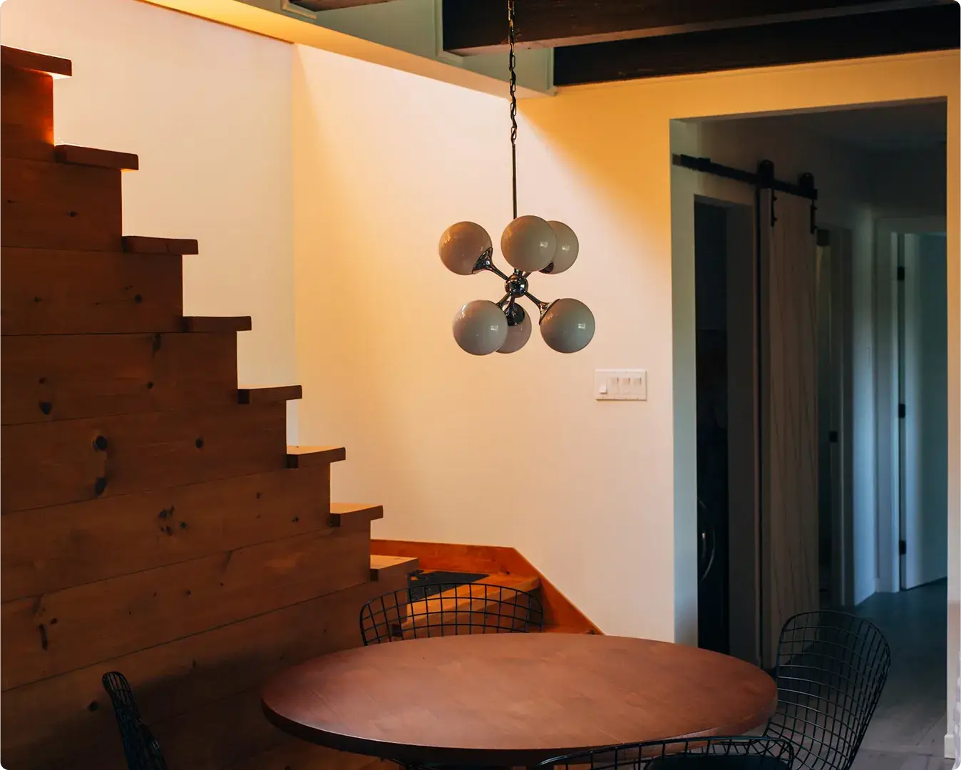 Wooden staircase and dining area in a modern home